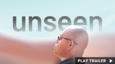 Trailer for documentary “UNSEEN” directed by Set Hernandez. A man in a black baseball cap and blue shirt. https://vimeo.com/884177216