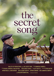 Film Poster for "The Secret Song". A man has a smile on his face as he points drum mallets toward his students.