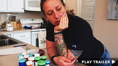 Trailer for documentary "Medicating Normal" directed by Lynn Cunningham & Wendy Ractliffe. Woman in kitchen standing over her medications. https://vimeo.com/490885411