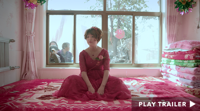 Trailer for documentary "Leftover Women" directed by Shosh Shlam & Hilla Medalia. Woman sitting down wearing pink dress. https://vimeo.com/430548247