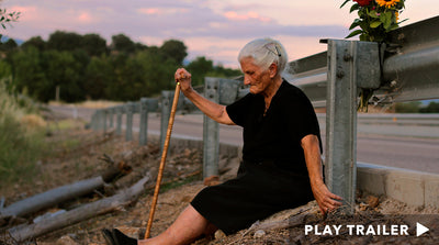 Trailer for documentary "The Silence of Others" directed by Almudena Carracedo & Robert Bahar. Old lady sitting on side of the road with her cane. https://vimeo.com/359846051
