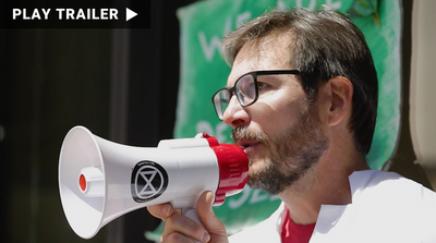 Trailer for documentary "Arresting Science" directed by Holly Becker. Close up of man holding megaphone. https://vimeo.com/1045520802