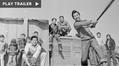 Trailer for documentary “BASEBALL BEHIND BARBED WIRE” directed by Yuriko Gamo Romer. A black and white photo of Japanese Americans behind barbed wire with a red transparent square that includes the title. https://vimeo.com/895956634