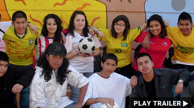 Trailer for documentary “FUTBOLISTAS 4 LIFE” directed by Jun Stinson. A group of kids standing in front of a mural, with one holding a soccer ball. https://vimeo.com/1002402599