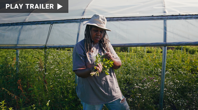 Trailer for documentary "Food and Country" directed by Laura Gabbert. Woman holding plants in garden. https://vimeo.com/1053882701