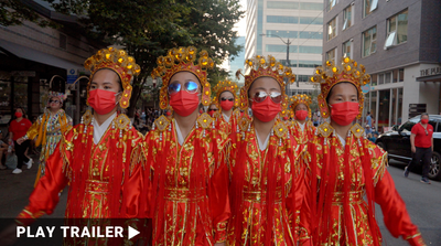  Trailer for documentary “SHE MARCHES IN CHINATOWN” directed by Della Chen. Women in traditional costumes and glasses walk down the street. https://vimeo.com/1011107168