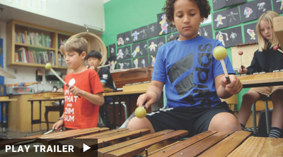 Trailer for "The Secret Song" directed by Samantha Campbell. In a classroom, young students play musical instruments. https://vimeo.com/915272419
