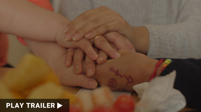  Trailer for documentary “FLY IN POWER” directed by Yin Q. Close-up of hands holding each other. https://vimeo.com/1017283560