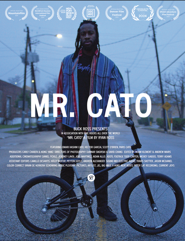 FIlm poster for "Mr. Cato." A man with a bike on a street.