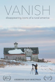 Film poster for "VANISH: DISAPPEARING ICONS OF A RURAL AMERICA". A photographery stands with a camera in the winter with an abandoned house in the background.