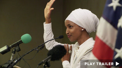 Trailer for documentary "Time For Ilhan" directed by Norah Shapiro. Woman holding her hand up in front of mic. https://vimeo.com/310435279