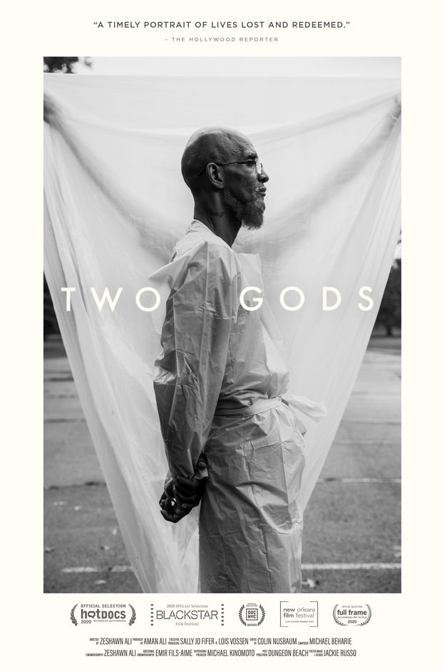 Film poster for "Two Gods" with side profile of man standing in front of white sheet in black and white.