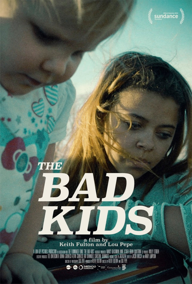 Film poster for "The Bad Kids" with mom and baby looking over something together.