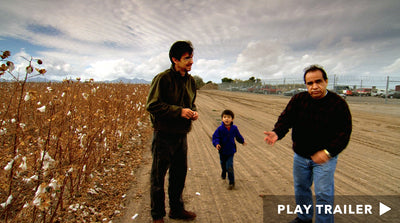 Trailer for documentary "Calavera Highway" directed by Renee Tajima-Peña. Two men and child standing on a dirt road next to field. https://vimeo.com/492246682