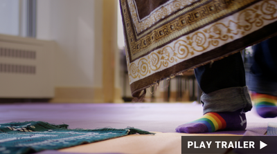Trailer for documentary "Unity Mosque" directed by Nicole Teeny. Rainbow socks next to mat. https://vimeo.com/742014338