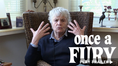 Trailer for documentary "Once A Fury" directed by Jacqueline Rhodes. Old woman in chair with her hands up towards her face. https://vimeo.com/696710113
