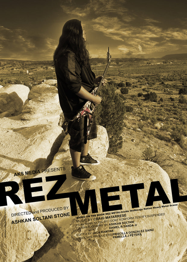 Film poster for "Rez Metal" with man playing electric guitar on mountain.